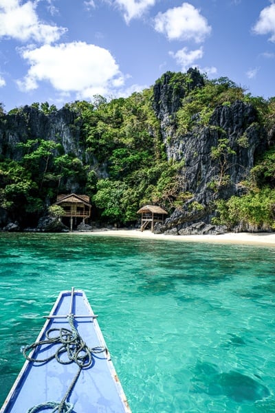 Boat on turquoise water in El Nido Palawan