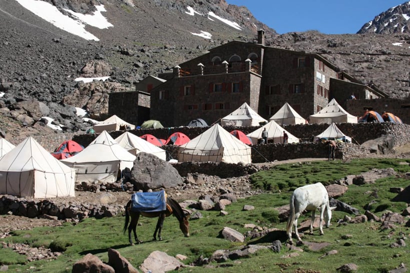 Camping tents and horses outside the Refuge Les Mouflons in Toubkal