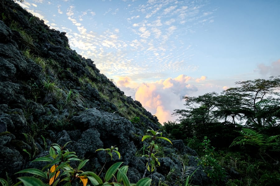 Hiking out of the jungle and into the steep lava rocks