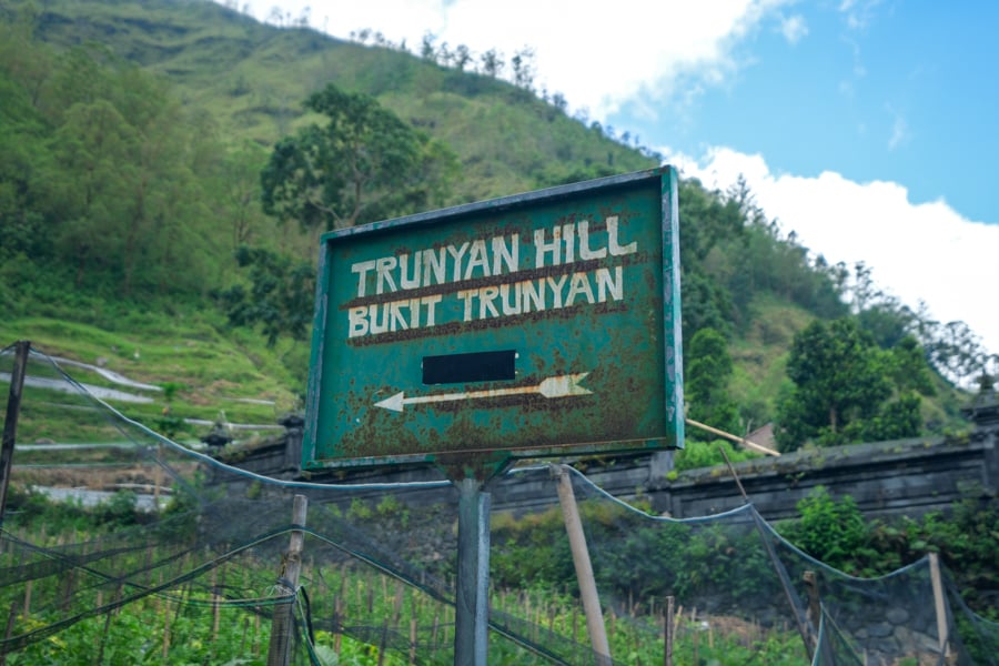 Sign in Trunyan village marking the start of the hike