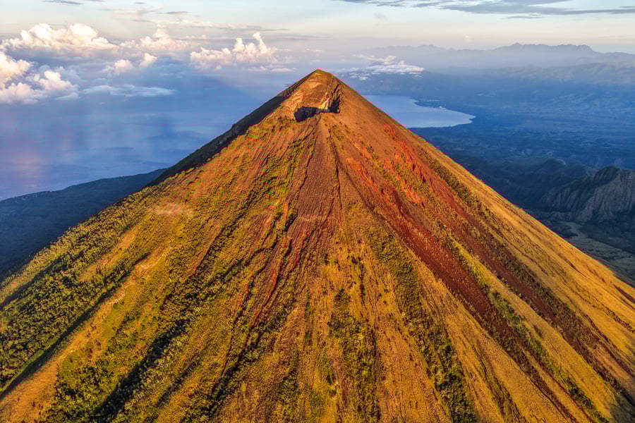 Volcanic peak of Mount Inerie glowing in the morning sun drone photo