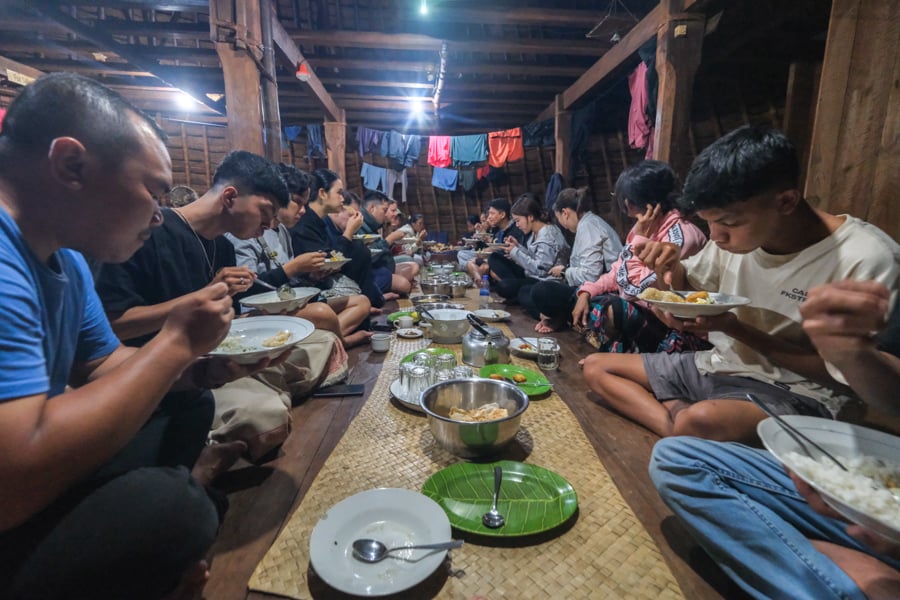 Eating supper inside the hut dining room