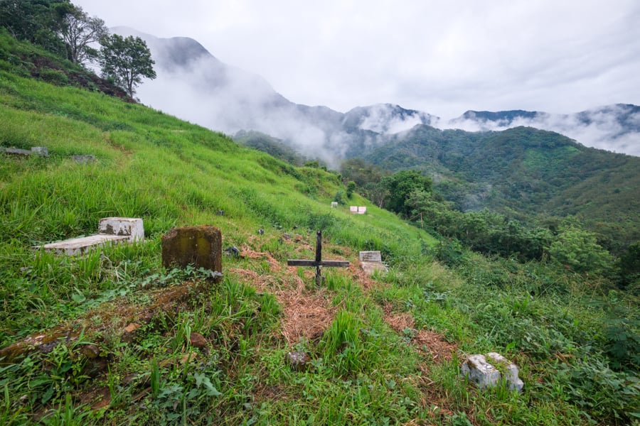 A small cemetery with graves on the hill above the village
