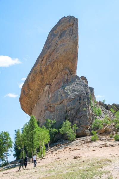 Tourists walking below Turtle Rock in Terelj National Park