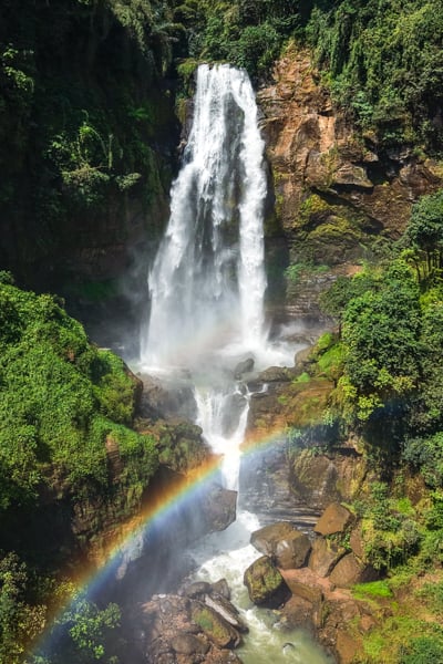 Upper falls and rainbow at Tengkulese Waterfall in Ruteng