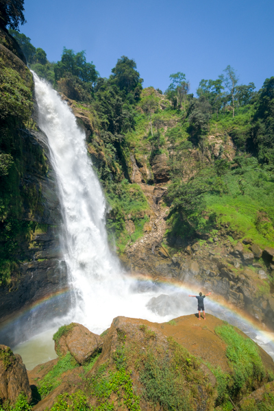 Lower falls and rainbow at Tengkulese Waterfall in Ruteng