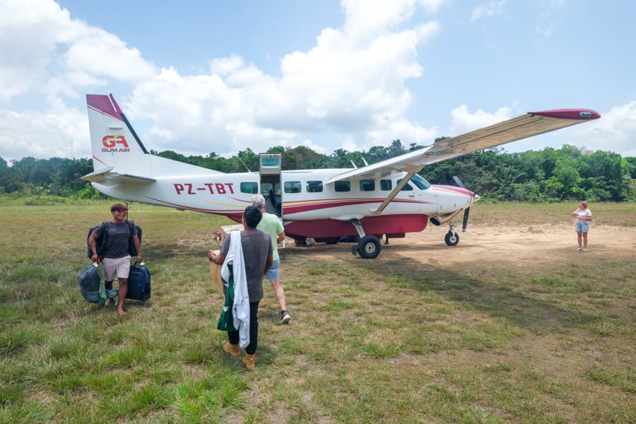 Unloading a bush plane at the Palumeu airstrip