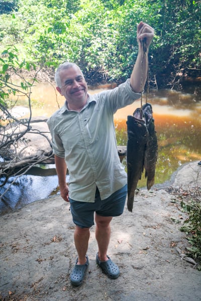 Tourist holding some anjumara fish