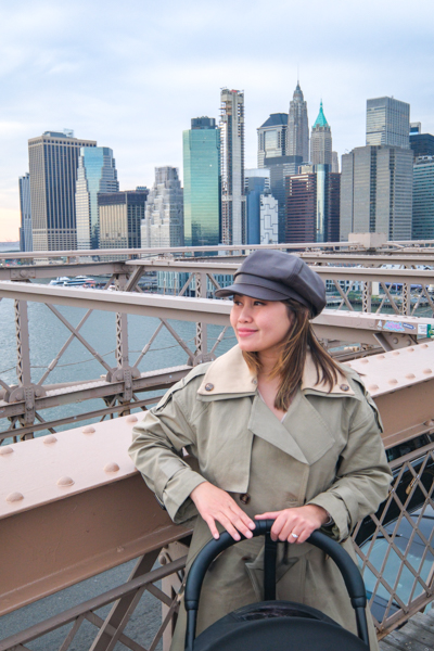 Posing on the Brooklyn Bridge with the Manhattan skyline
