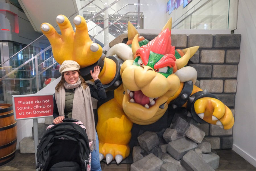 Posing with Bowser from Mario at the Nintendo store