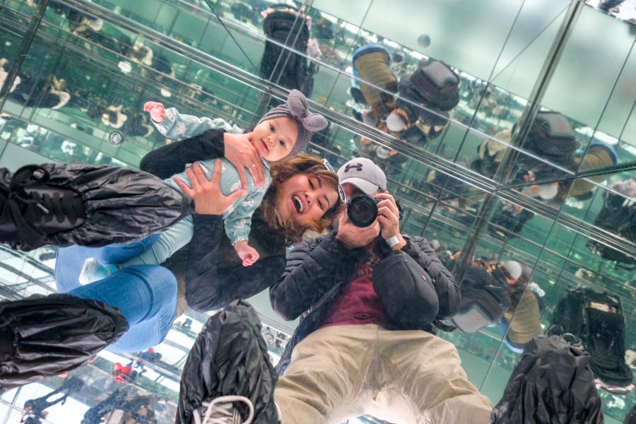 Mirror room at Summit One Vanderbilt New York City with a baby